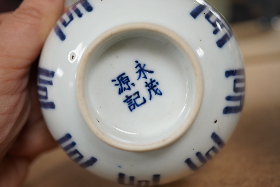 A Chinese powder blue stem cup and a blue and white 'shou' cup, largest 10cm in diameter. Condition - good